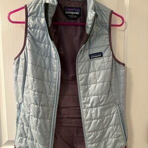 Patagonia Light Blue Quilted Vest with Purple Interior Trim